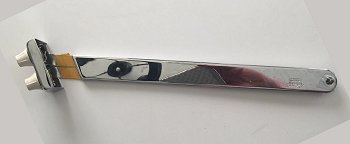 A long-discontinued DeArmond with volume and tone controls and a 1/4-inch jack. Click for bigger photo.
