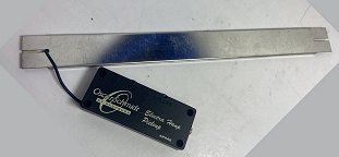 A discontinued Oscar Schmidt aftermarket pickup with tiny volume and tone controls and a 1/8-inch jack. Click for bigger photo.