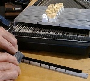 With a very sharp blade notch little 'V'-shaped cuts into the felt where you've marked them. Click for bigger photo.