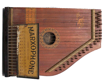 This 'Marxaphone' has tiny lead hammers that strike the doubled melody strings when you push the appropriate lever.  They say it sounds something like a celeste.  If you don't know what that sounds like, try to imagine a child's toy piano played in tune.  Click for bigger photo.
