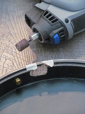 My Dremel and the hole I carved to get the back of the jack to fit inside the resonator.  Even though I was being very careful I went about 1/32