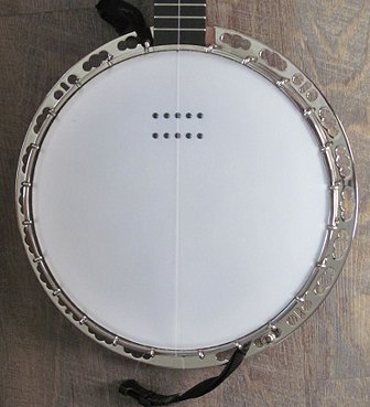 The head and resonator flange of a first-gen Deering Sierra with a Kavanjo pickup attached. Click for bigger photo.