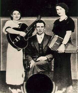 The Carter Family several years before their first recording.  Sarah may be holding the 8-chord Model 72 7/8 that is now on display at the Country Music Hall of Fame and Museum. Sorry, I don't have a bigger photo.